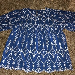 Blue blouse with white embroidered details